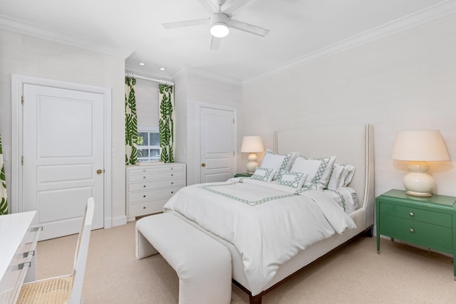 bedroom with crown molding, light colored carpet, and ceiling fan