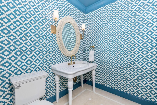 bathroom with vanity, concrete flooring, wooden walls, and lofted ceiling