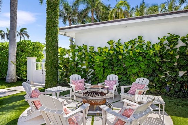 view of patio / terrace with a fire pit