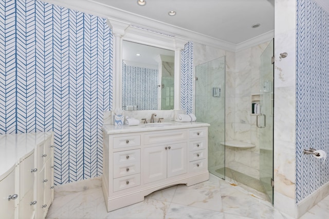 bathroom with marble finish floor, vanity, a shower stall, and ornamental molding