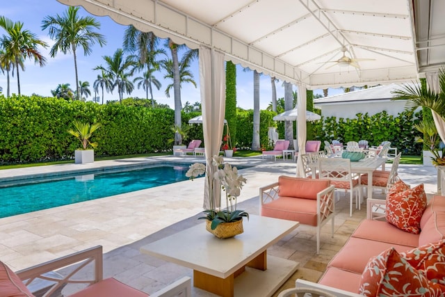 view of swimming pool with a patio and an outdoor hangout area