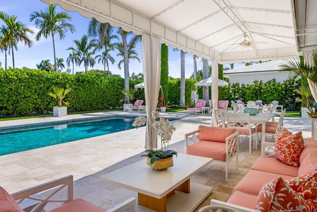 view of swimming pool with a fenced in pool, an outdoor hangout area, and a patio area