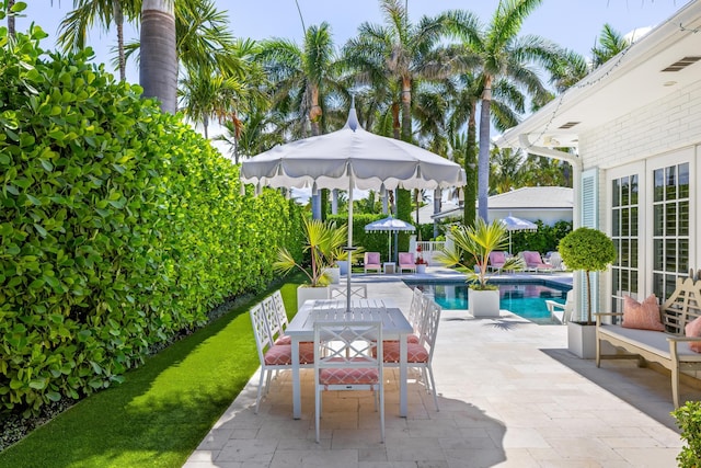 view of patio / terrace featuring an outdoor pool