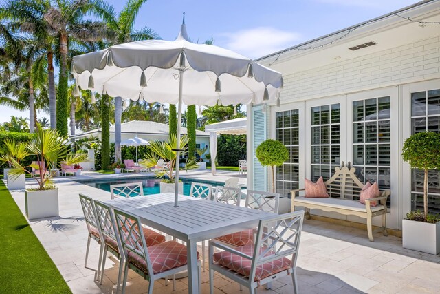 view of swimming pool with a gazebo and a patio area