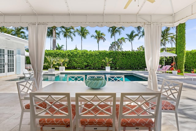 view of pool with a gazebo, french doors, a patio, and a fenced in pool