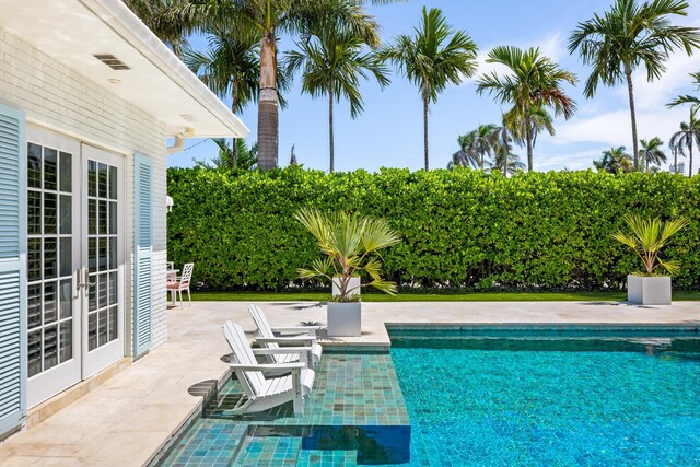 view of swimming pool with a patio