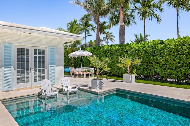 pool featuring a patio and french doors