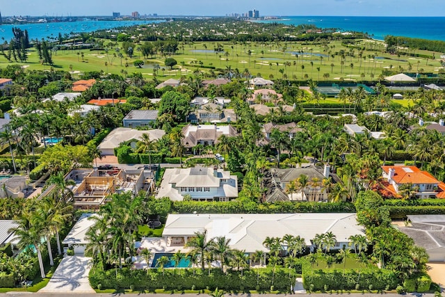 aerial view featuring view of golf course, a water view, and a residential view