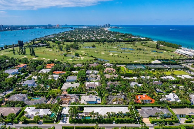 drone / aerial view featuring a water view and view of golf course