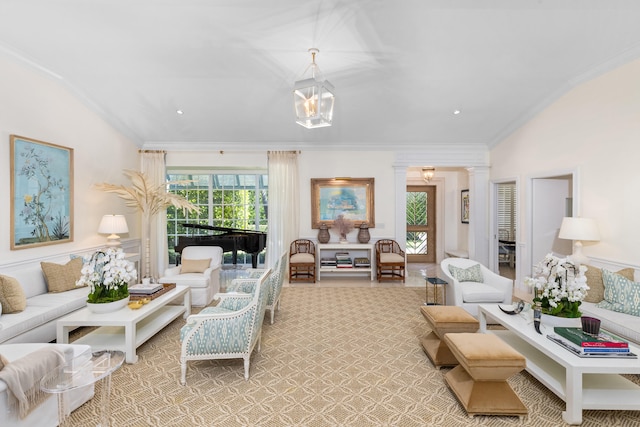 living room featuring vaulted ceiling, decorative columns, a notable chandelier, and ornamental molding