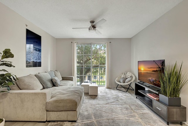 630 S Sapodilla Ave Unit 223, West Palm Beach, FL 33401 - living area featuring a ceiling fan and a textured ceiling