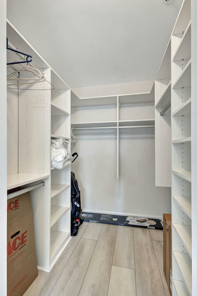 walk in closet featuring hardwood / wood-style floors