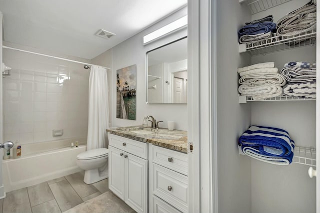 full bathroom with vanity, toilet, and shower / bath combo with shower curtain