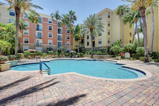 view of swimming pool featuring a patio area and pool water feature