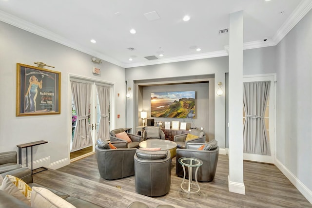 living room featuring crown molding and wood-type flooring