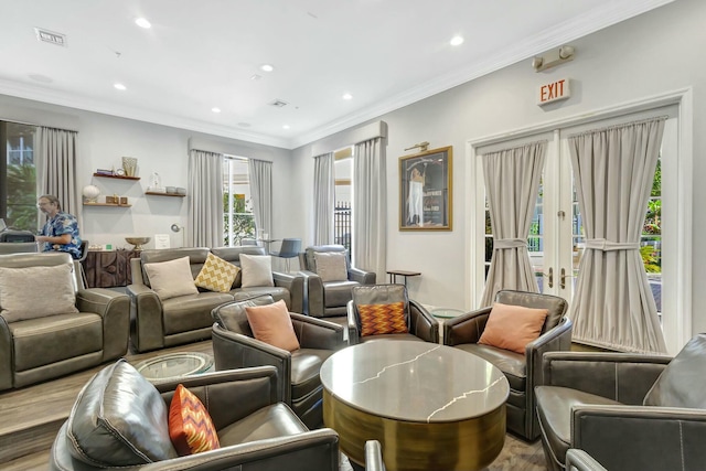 living room featuring crown molding and wood-type flooring