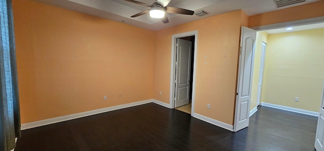 unfurnished bedroom with ceiling fan and dark hardwood / wood-style flooring