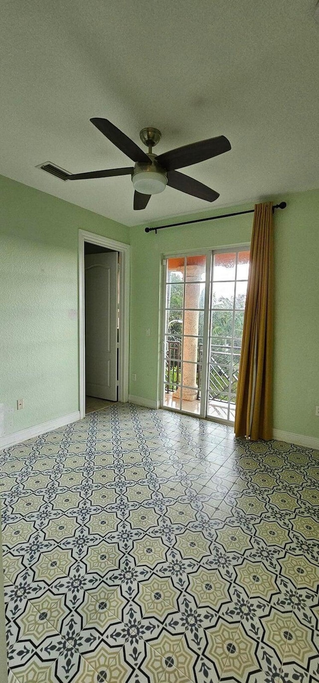 unfurnished room featuring ceiling fan