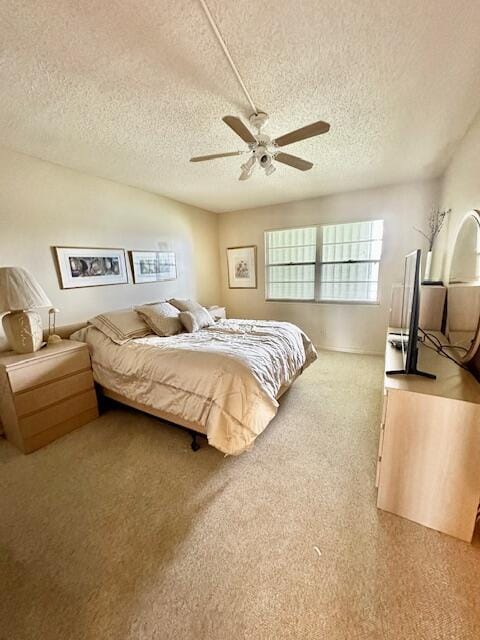 bedroom featuring a textured ceiling and ceiling fan