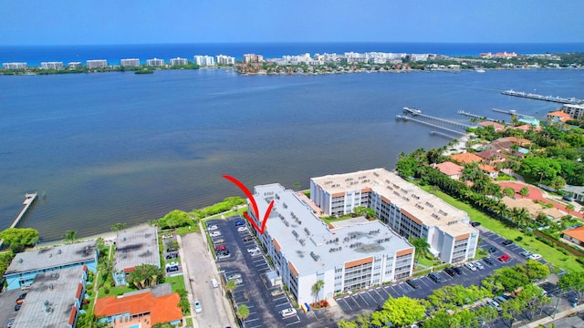 birds eye view of property featuring a water view