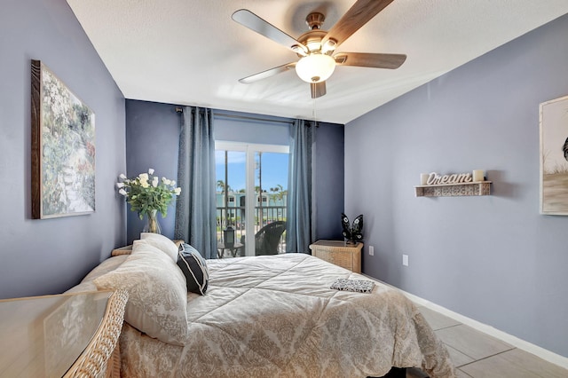 bedroom with access to exterior, ceiling fan, and tile patterned flooring