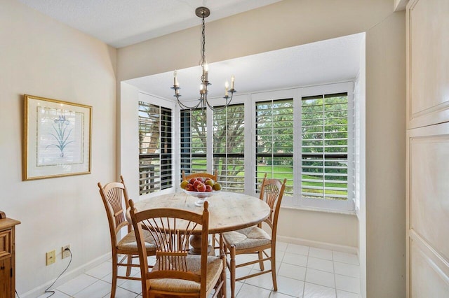 tiled dining space featuring a textured ceiling and a notable chandelier