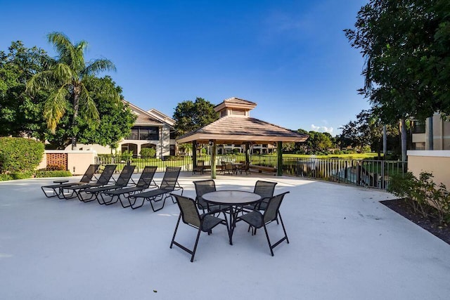 view of patio / terrace featuring a water view and a gazebo