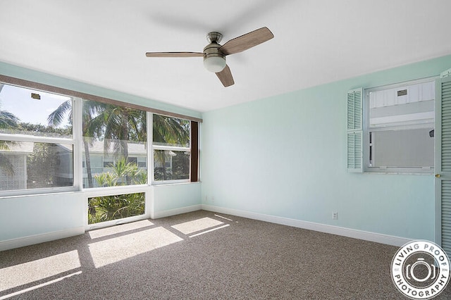 unfurnished sunroom featuring ceiling fan