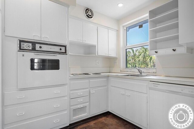 320 S Ocean Blvd Unit U-C, Delray Beach, FL 33483 - kitchen with white appliances, open shelves, a sink, light countertops, and white cabinetry