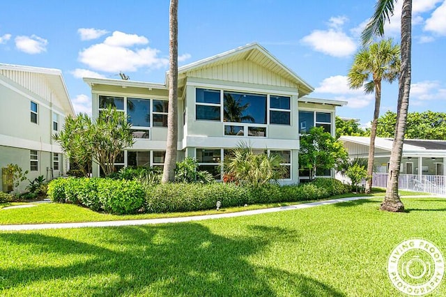 320 S Ocean Blvd Unit U-C, Delray Beach, FL 33483 - rear view of house featuring a yard