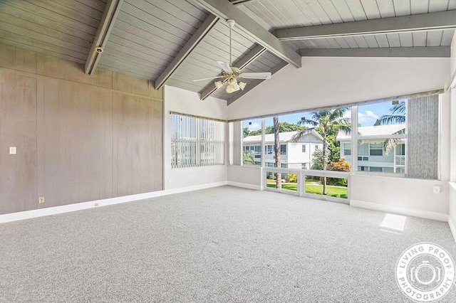 unfurnished sunroom with vaulted ceiling with beams and ceiling fan