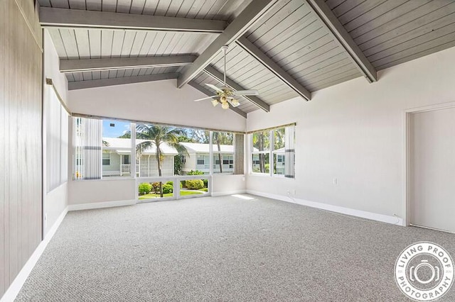 unfurnished sunroom featuring lofted ceiling with beams, wood ceiling, and a ceiling fan