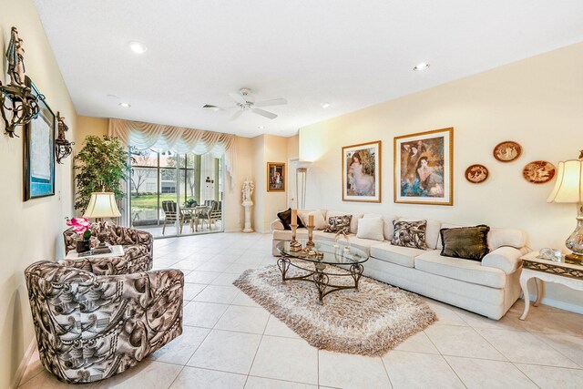 tiled living room with ceiling fan