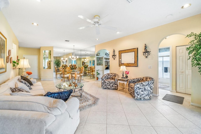 tiled living room featuring ceiling fan