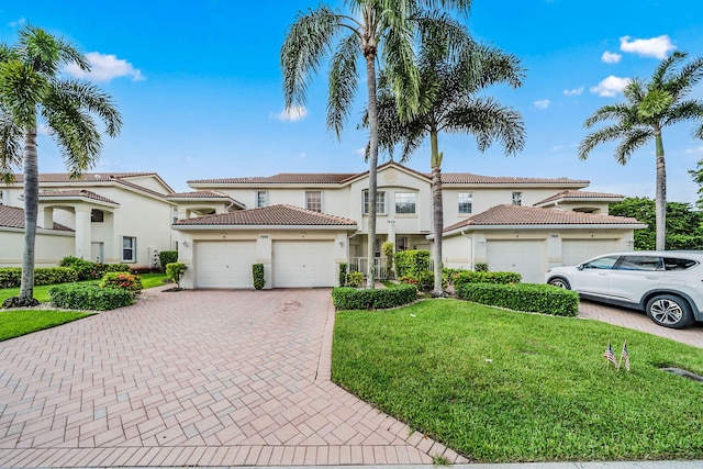 mediterranean / spanish home with a front yard