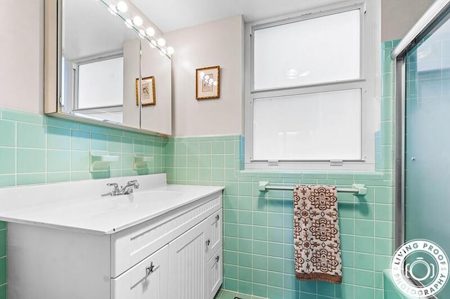 320 S Ocean Blvd Unit L-C, Delray Beach, FL 33483 - bathroom with tile walls, vanity, and a wainscoted wall