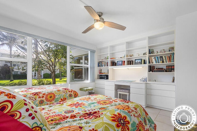 bedroom with multiple windows, ceiling fan, and light tile patterned floors