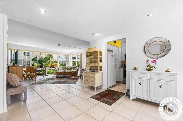 320 S Ocean Blvd Unit L-C, Delray Beach, FL 33483 - living room featuring light tile patterned flooring and recessed lighting
