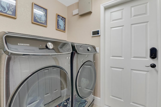 washroom featuring independent washer and dryer and tile patterned floors