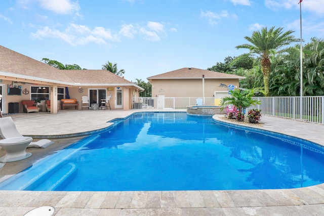 view of swimming pool with a patio area