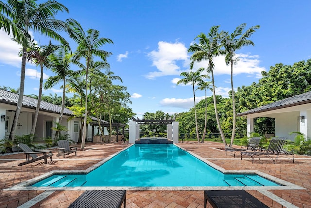 view of pool featuring a pergola and a patio