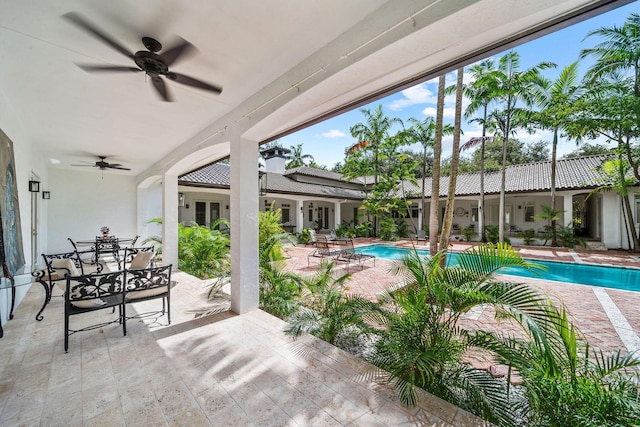 view of pool featuring ceiling fan and a patio