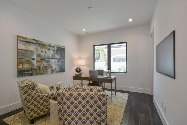 office with dark hardwood / wood-style floors