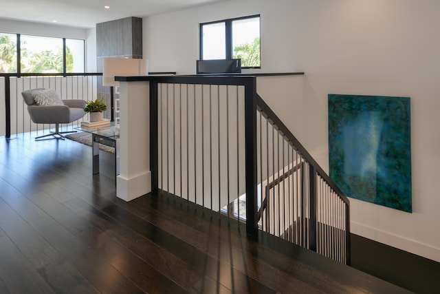 stairs featuring dark wood-type flooring