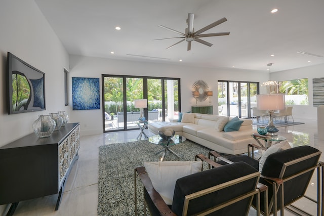 living room with ceiling fan and a wealth of natural light