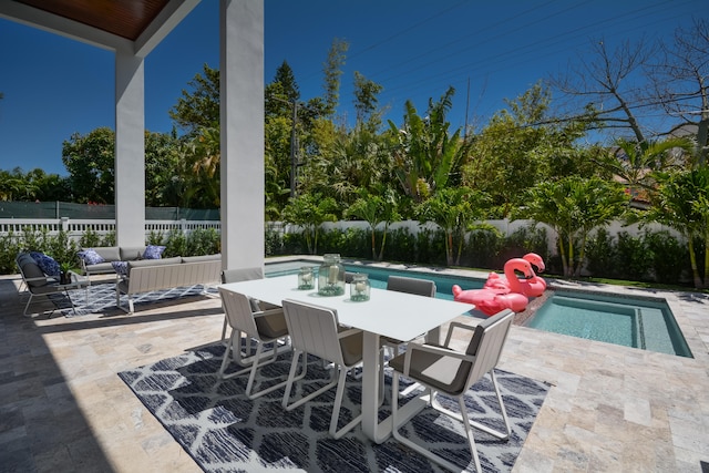 view of patio with a fenced in pool