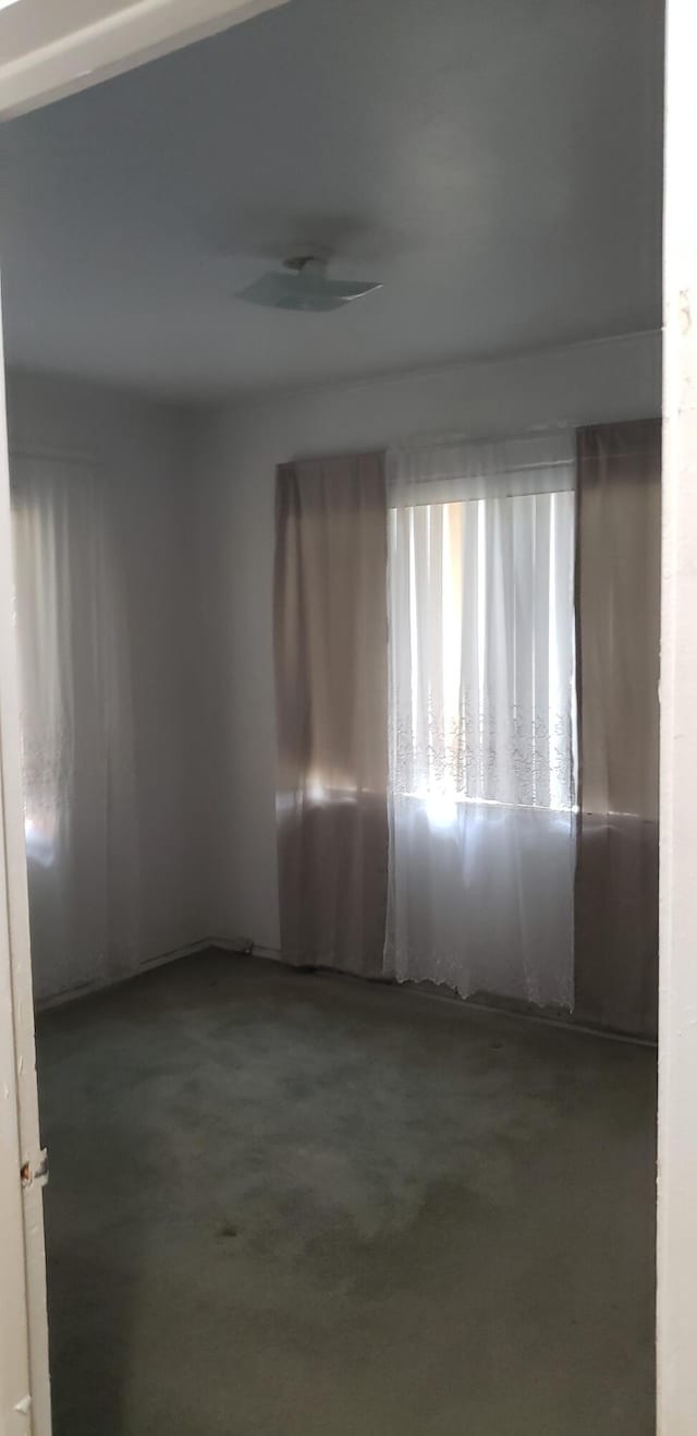spare room with concrete floors