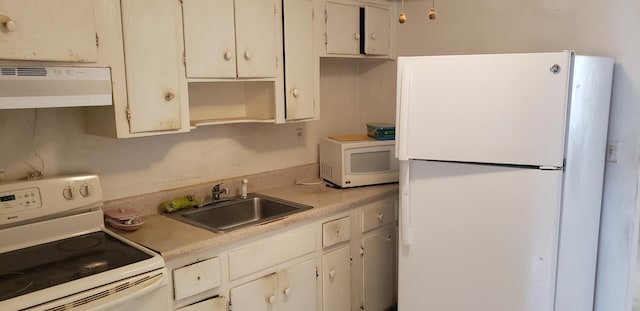 kitchen featuring white cabinetry, light countertops, white appliances, exhaust hood, and a sink