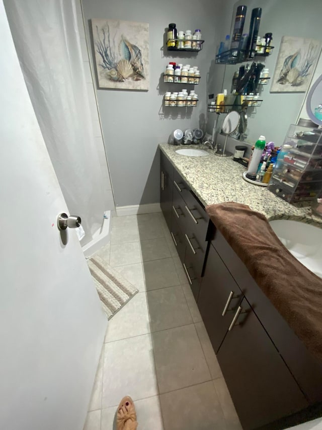 bathroom featuring tile patterned floors and double vanity