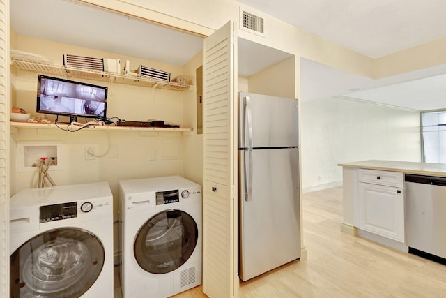 laundry room featuring washing machine and dryer